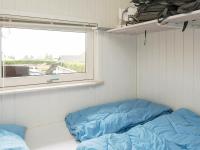 Postel nebo postele na pokoji v ubytování 8 person holiday home in Sjølund-By Traum