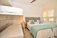 A bed or beds in a room at 70sqm private terrace in front of the sea & 107sqm brand new apartment