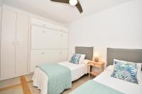 A bed or beds in a room at 70sqm private terrace in front of the sea & 107sqm brand new apartment