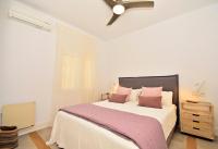 A bed or beds in a room at 70sqm private terrace in front of the sea & 107sqm brand new apartment