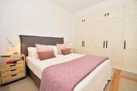 A bed or beds in a room at 70sqm private terrace in front of the sea & 107sqm brand new apartment