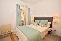 A bed or beds in a room at 70sqm private terrace in front of the sea & 107sqm brand new apartment