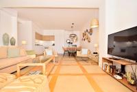 A television and/or entertainment centre at 70sqm private terrace in front of the sea & 107sqm brand new apartment