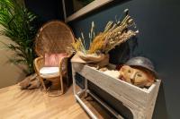 a wooden box with a helmet and some plants at Hôtel Saint-Julien in Angers