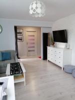 Televízia a/alebo spoločenská miestnosť v ubytovaní Apartament Rodzinny Słoneczne Tarasy