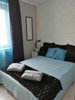Posteľ alebo postele v izbe v ubytovaní Apartament Rodzinny Słoneczne Tarasy
