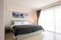 Postel nebo postele na pokoji v ubytování Tonkla Boutique Hotel