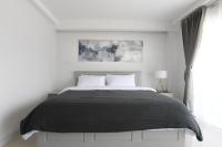 Postel nebo postele na pokoji v ubytování Tonkla Boutique Hotel