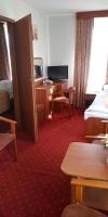 Posteľ alebo postele v izbe v ubytovaní Hotel Korona