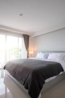 Postel nebo postele na pokoji v ubytování Tonkla Boutique Hotel