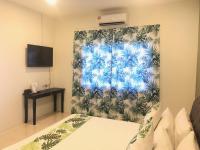 SANDY GARDEN RESORT LANGKAWIにあるテレビまたはエンターテインメントセンター