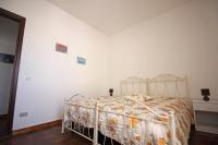 A bed or beds in a room at Casa Vacanza Valle della Cupa