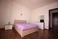 A bed or beds in a room at Casa Vacanza Valle della Cupa