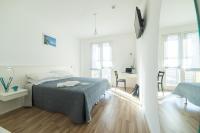 Posteľ alebo postele v izbe v ubytovaní ASPIO RESIDENCE