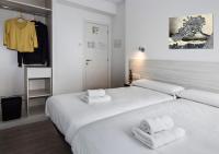 Postel nebo postele na pokoji v ubytování Hostal Lar
