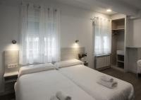 Postel nebo postele na pokoji v ubytování Hostal Lar
