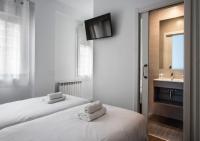 Postel nebo postele na pokoji v ubytování Hostal Lar