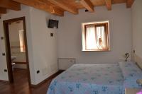 Posteľ alebo postele v izbe v ubytovaní Agriturismo Corte Maccini