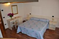 Posteľ alebo postele v izbe v ubytovaní Agriturismo Corte Maccini