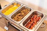 a tray of food with bacon mushrooms and scrambled eggs at Lam Hotel Convento do Desagravo in Oliveira do Hospital