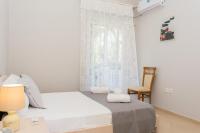 Posteľ alebo postele v izbe v ubytovaní Doroufi Inn