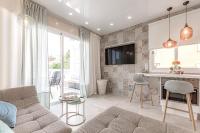 Televízia a/alebo spoločenská miestnosť v ubytovaní Apartment Orlando Wave