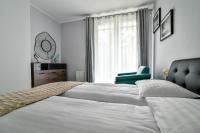 Posteľ alebo postele v izbe v ubytovaní Małe Orłowo LTC - Apartments