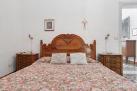 A bed or beds in a room at La Torre Antica Dimora