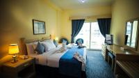 Green House Hotel Suites & Apartmentにあるベッド