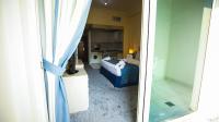 Green House Hotel Suites & Apartmentにあるベッド
