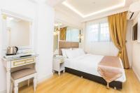 Postel nebo postele na pokoji v ubytování City Hall Hotel Sultanahmet
