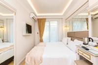 Postel nebo postele na pokoji v ubytování City Hall Hotel Sultanahmet