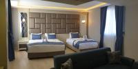 Postel nebo postele na pokoji v ubytování Martinenz Hotel
