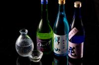 a group of three bottles of wine and a glass at Karuizawa Prince Hotel West in Karuizawa