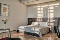 Łóżko lub łóżka w pokoju w obiekcie Hotel Monopol