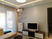 Televízia a/alebo spoločenská miestnosť v ubytovaní Luna apartment