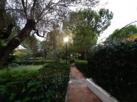 a street light in a garden with a brick path at a due passi dal mare in Diamante