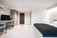 Postel nebo postele na pokoji v ubytování Tonkla Boutique Hotel