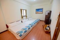 a bedroom with a large bed in a room at Sweet Dream Homestay in Magong