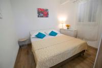 Postel nebo postele na pokoji v ubytování La Storia Apartments