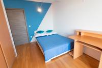 Postel nebo postele na pokoji v ubytování La Storia Apartments