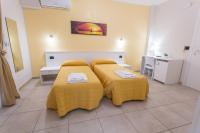 A bed or beds in a room at I Granai Messina