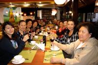 a group of people sitting at a table drinking wine at Hotel Green Horizon in Kathmandu