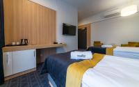Posteľ alebo postele v izbe v ubytovaní Hotel Nad Czernicą