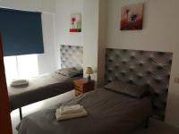 Postel nebo postele na pokoji v ubytování Casas Holiday - Playa del Cura 2