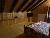A television and/or entertainment centre at Casevacanza Val d'Ayas