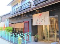a building with a sign on the side of it at Kyoto Inn Gion The Second in Kyoto