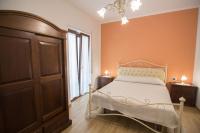 A bed or beds in a room at Relax da Carmen