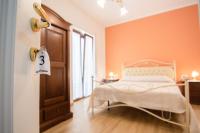 A bed or beds in a room at Relax da Carmen
