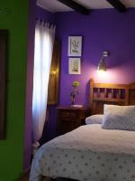 Postel nebo postele na pokoji v ubytování Apartamentos La Iguana